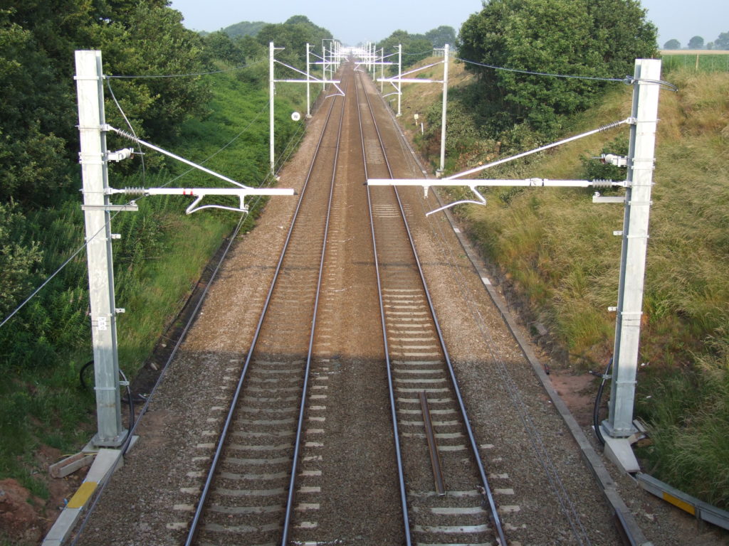 Series 2 overhead line equipment installed on a UK mainline rail corridor.