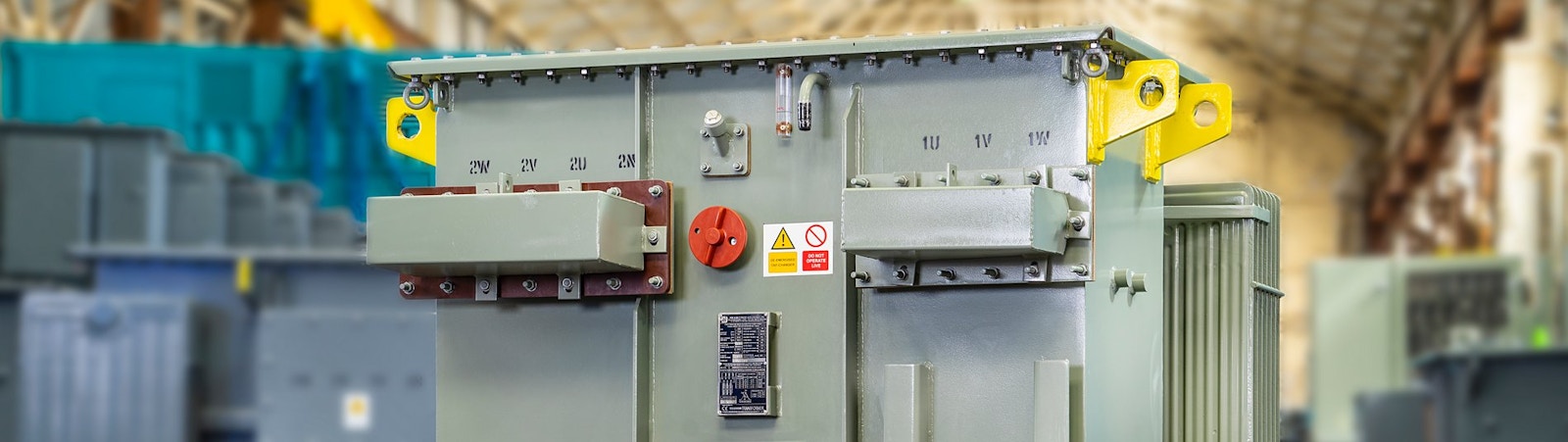 Distribution transformer unit on a factory test bay.